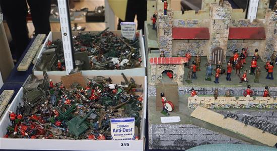 A quantity of Britains and other diecast military figures with fort.